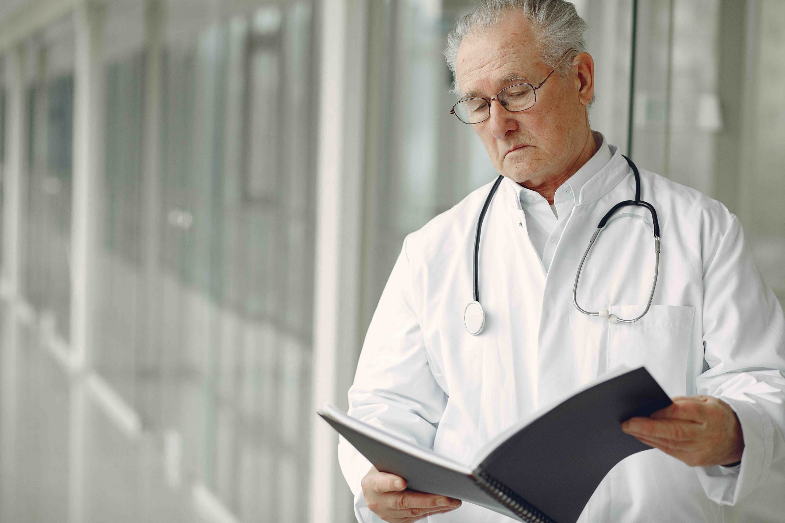 doctor looking at his notes