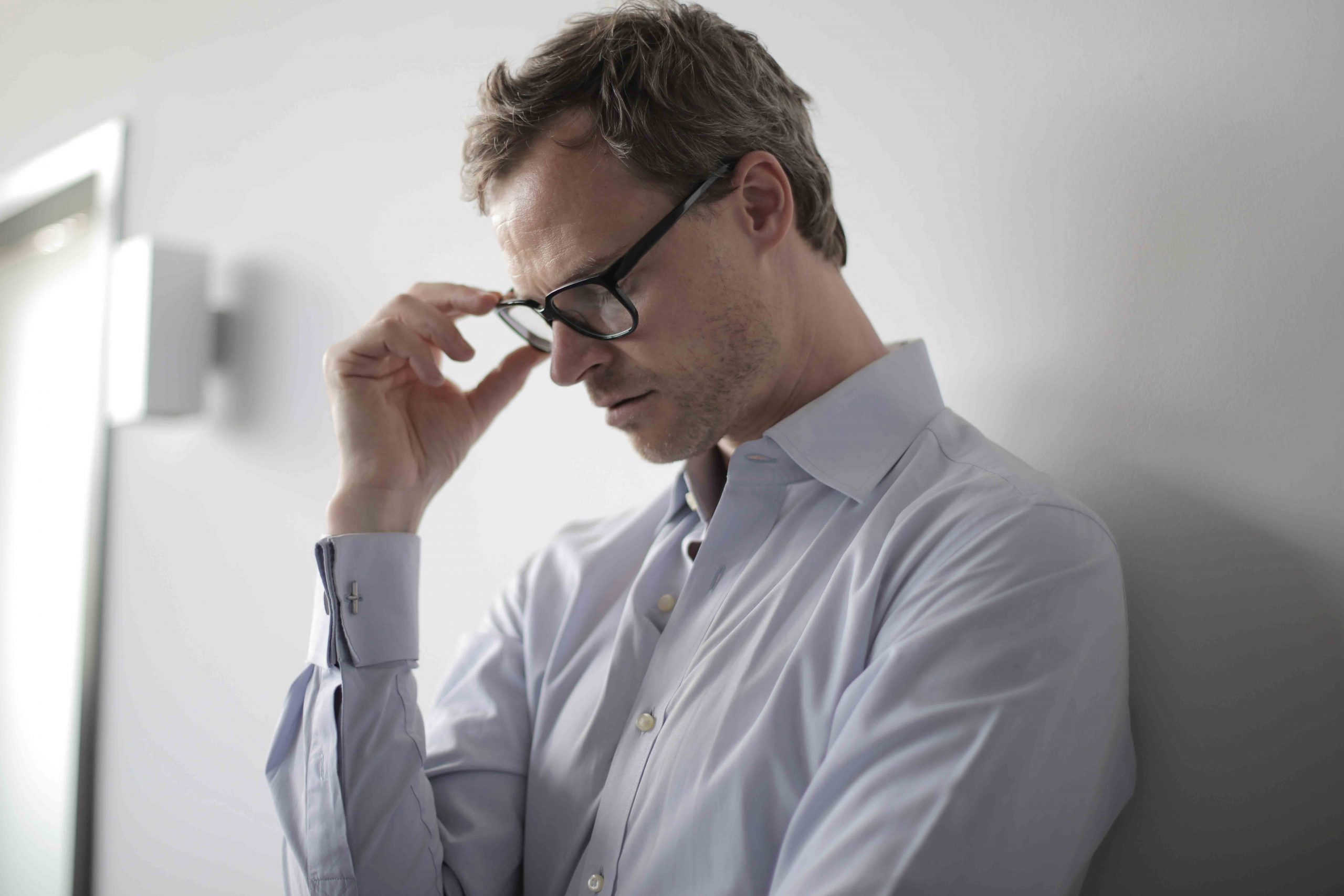 man in glasses looking worried-1