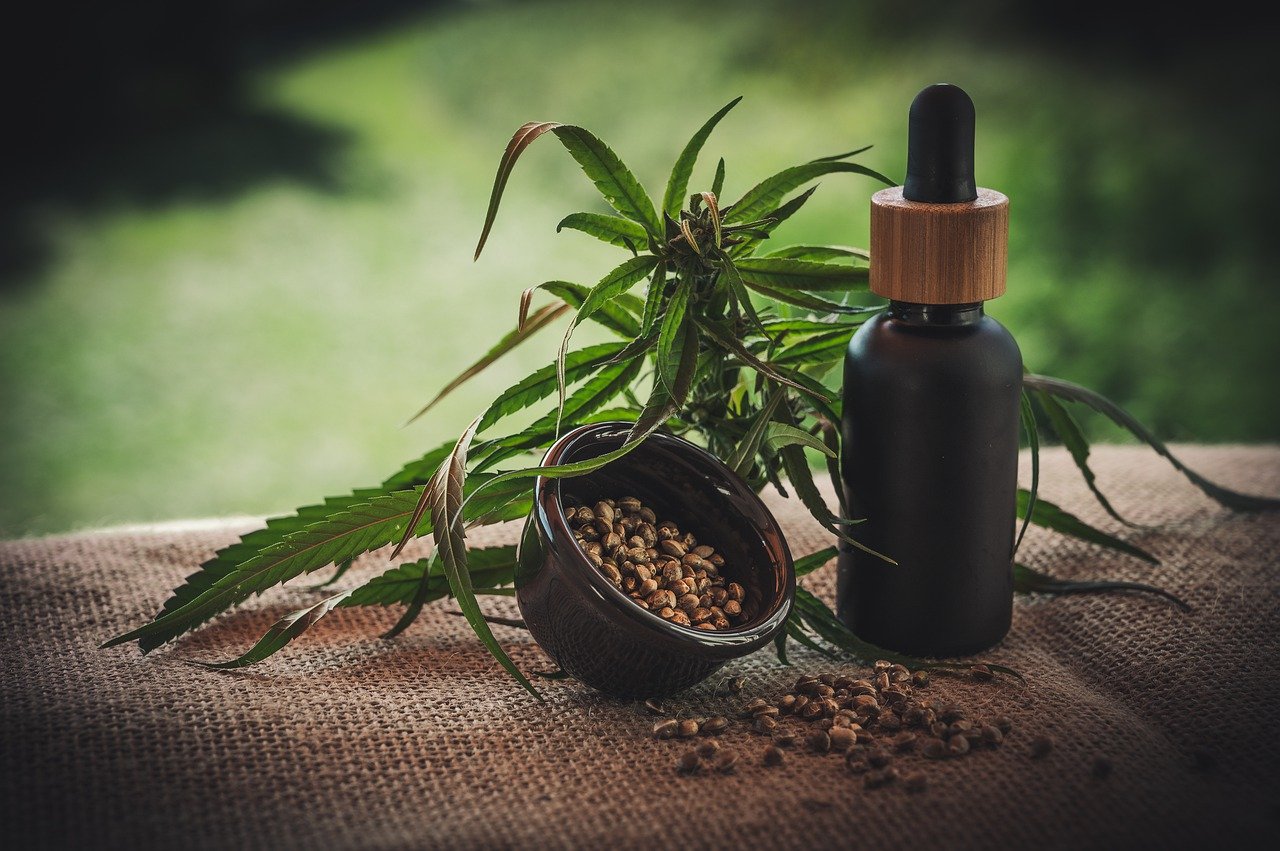 small black bottle and hemp seeds
