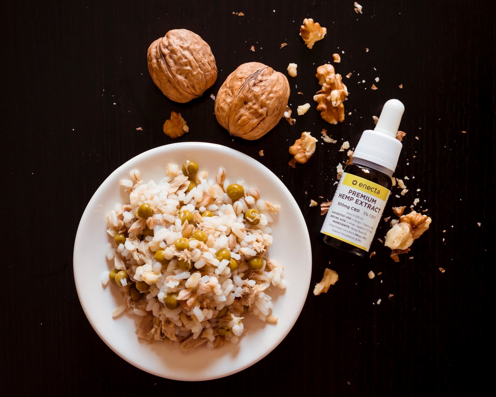 bowl of rice with small hemp oil bottle next to it