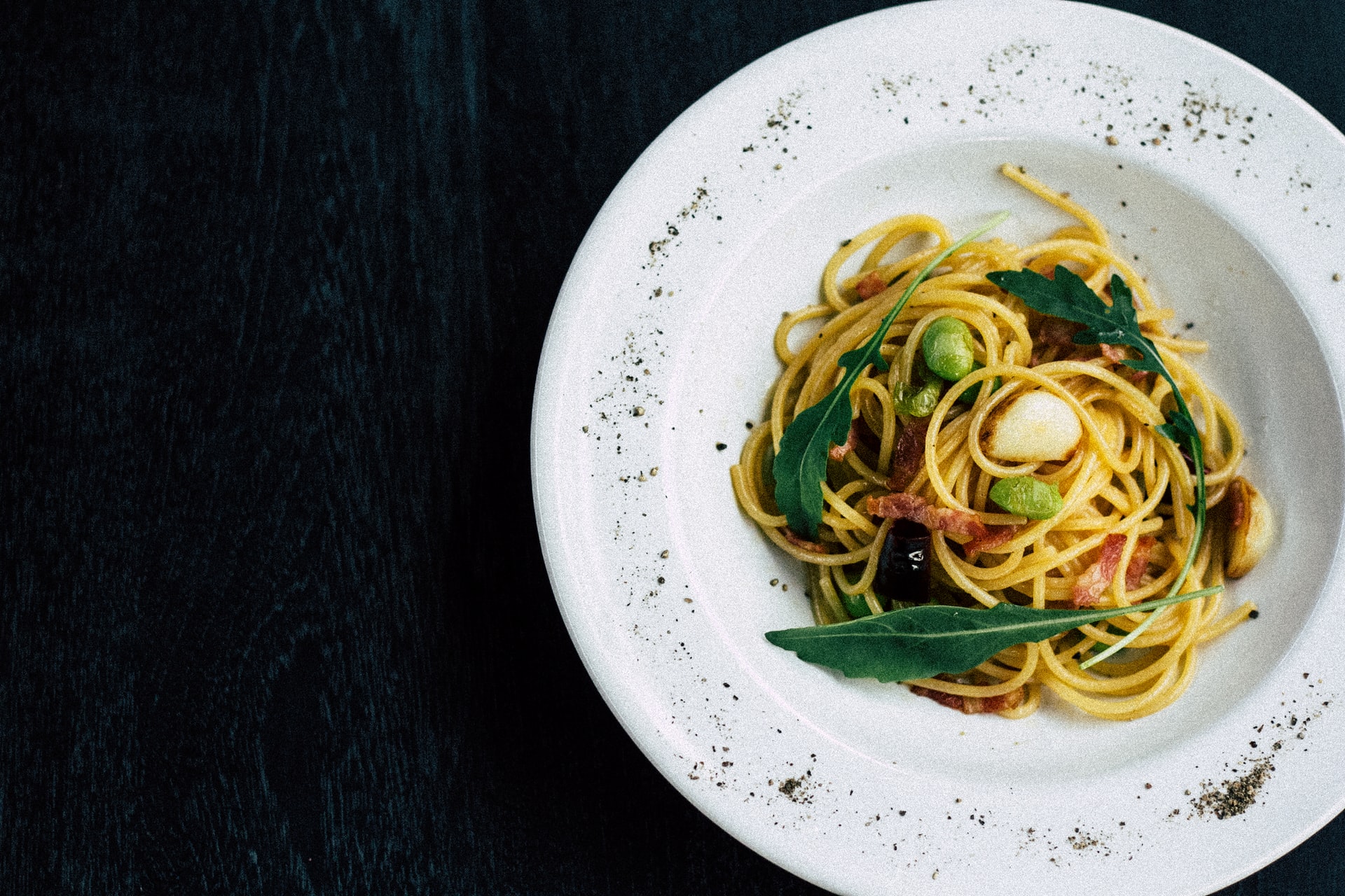 spaghetti dish in white bowl